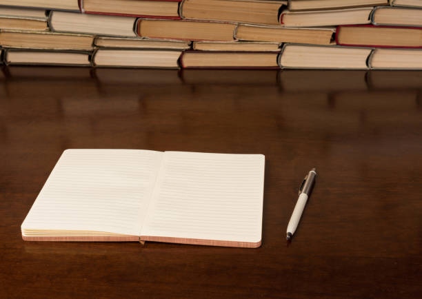 istock notebook and pen on the wooden table 1134362986