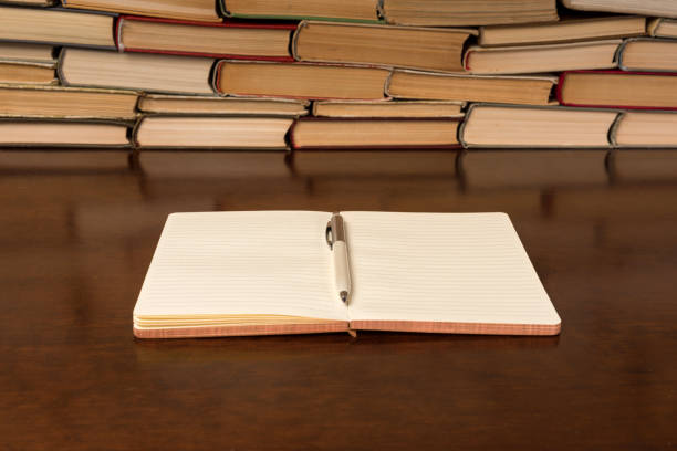 istock notebook and pen on the background of books 1134362988