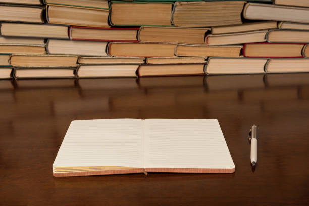 istock notebook and pen on the background of books 1134363001