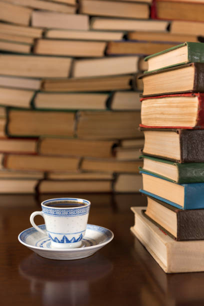 istock cup of coffee on the background of books 1134363003