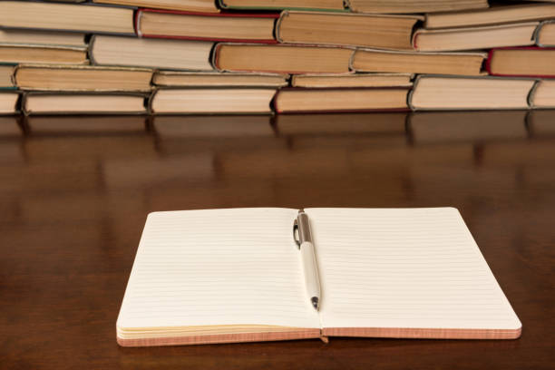 istock notebook and pen on the background of books 1134363010