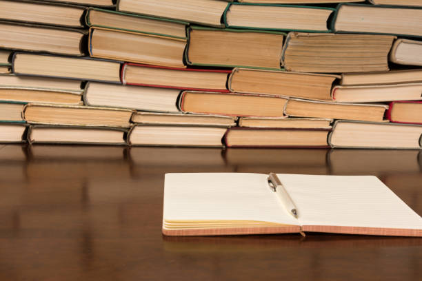 istock notebook and pen on the background of books 1134363015