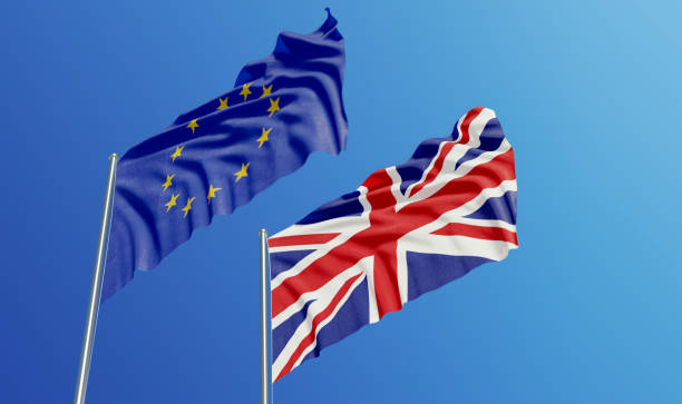 istock European Union and British Flags Waving With Wind 1134364039