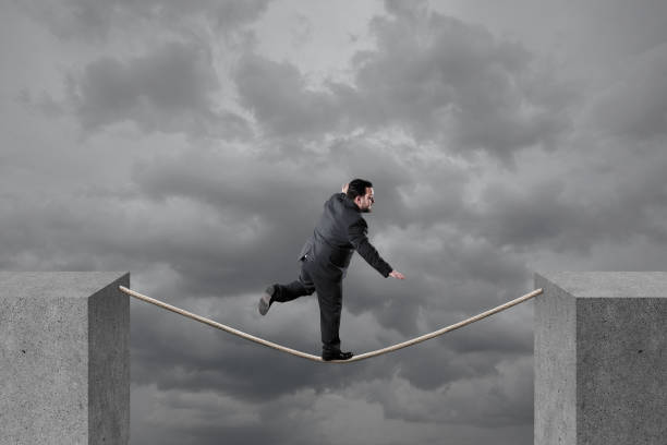 istock Businessman balancing on rope 1134364045