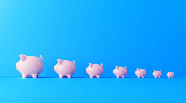 istock Piggybanks Forming A Bar Graph On Blue Background 1134364339