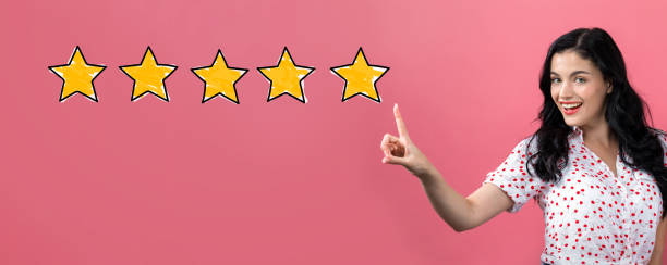 istock Five star rating with young woman 1134366966