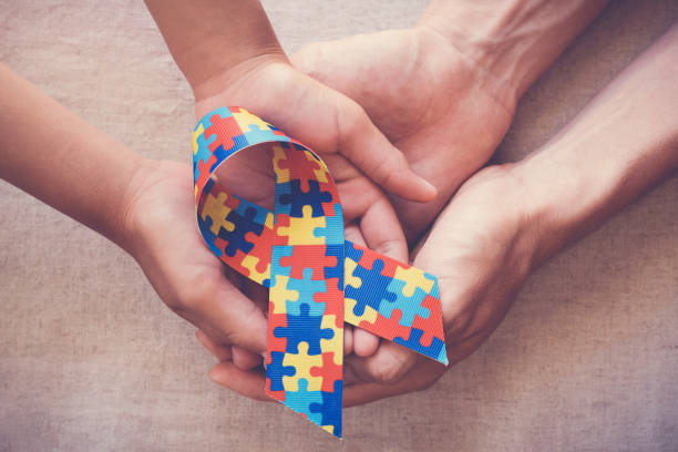 istock Hands holding puzzle ribbon for autism awareness 1134367573