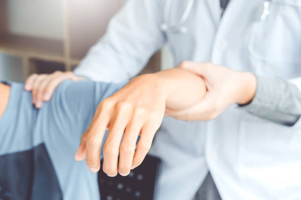istock Doctor consulting with patient Shoulder problems Physical therapy diagnosing concept 1134371595