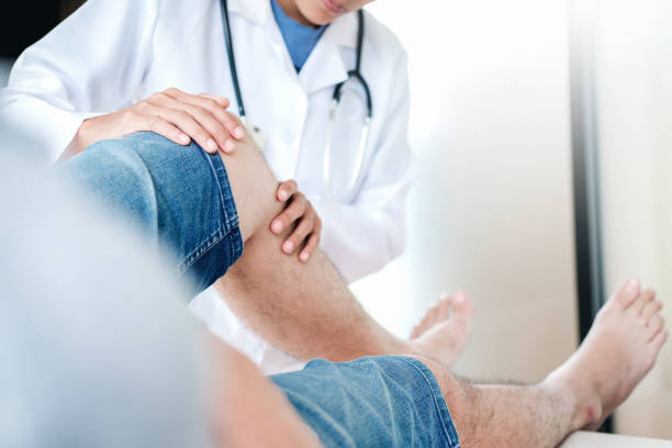 istock Doctor consulting with patient Knee problems Physical therapy concept 1134372182