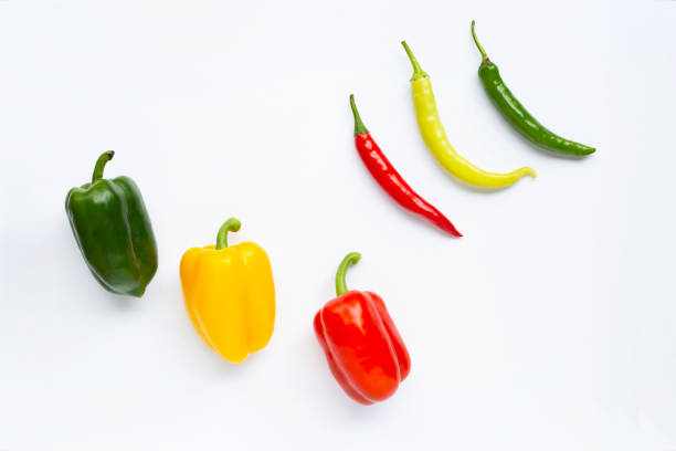 istock Different colors bell pepper and chili peppers isolated on white 1134373620