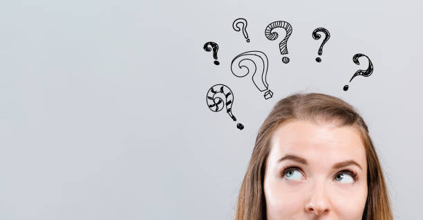 Hand draw question marks with young woman