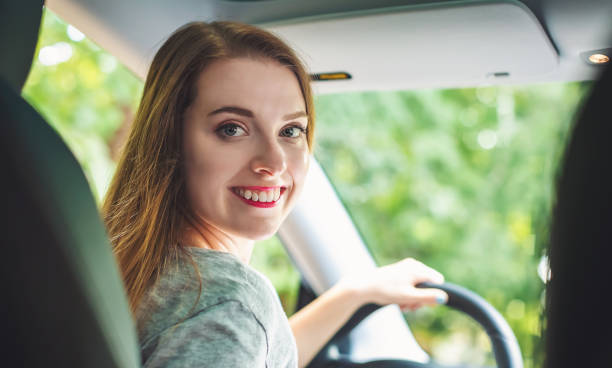 istock Happy young woman in a new car 1134373892