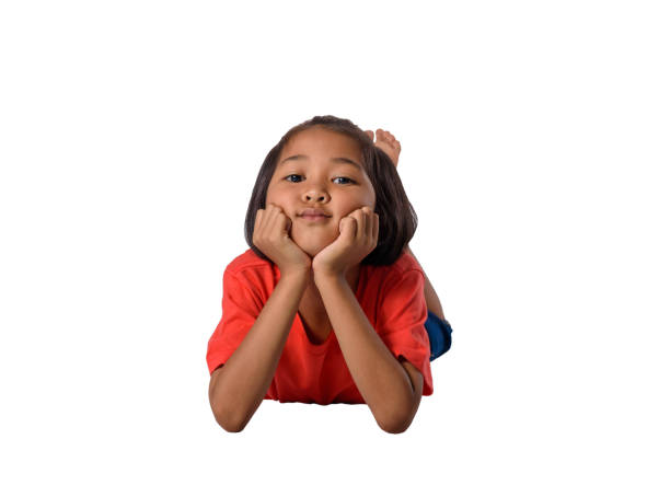 istock happy asian children lying on floor isolated white background 1134374820