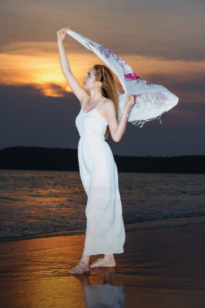 istock Beautiful woman relax on the beach 1134377556