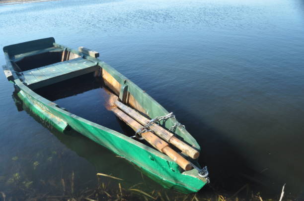 istock Rowing boat moored to the shore. Spring on the river. Floating. 1134378211
