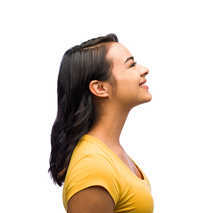 Side view of one young woman smiling in isolated on white background shot