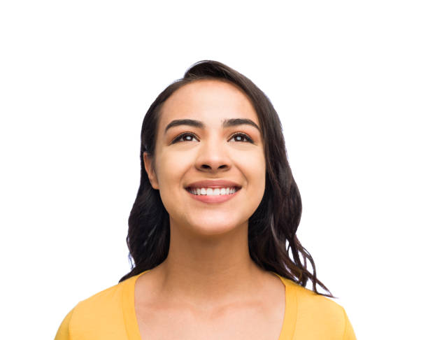 istock Beautiful young woman looking up 1134378247