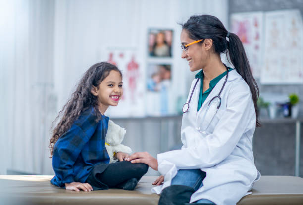 istock Doctor Comforting A Girl 1134380973