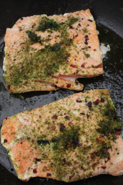 Pan-seared wild salmon flavored with dried seaweed Pan-seared wild salmon flavored with dried seaweed algue stock pictures, royalty-free photos & images