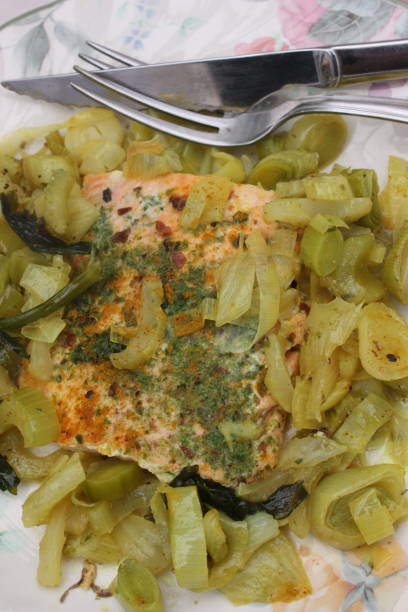 Pan-seared wild salmon flavored with dried seaweed Pan-seared wild salmon flavored with dried seaweed served with fennel leeks and celery cooked algue stock pictures, royalty-free photos & images