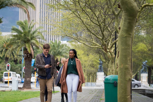 istock Two colleagues walking through the city streets 1134383439