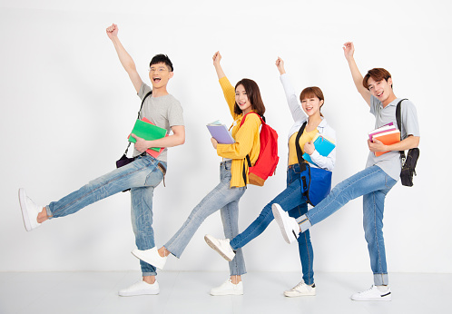 young group of student, smiling and dancing