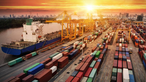 istock Logistics and transportation of Container Cargo ship and Cargo plane with working crane bridge in shipyard, logistic import export and transport industry background 1134387657