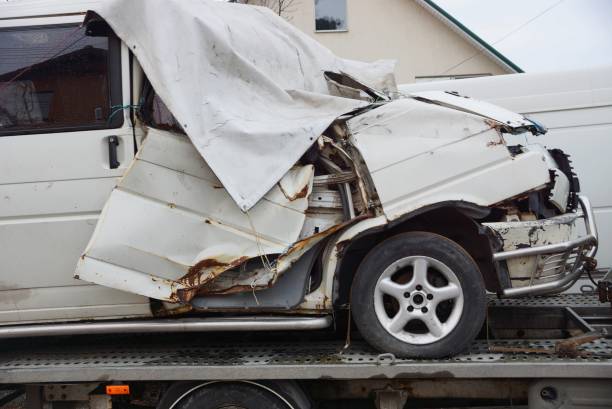 istock gray big broken car bus on a tow truck 1134388429