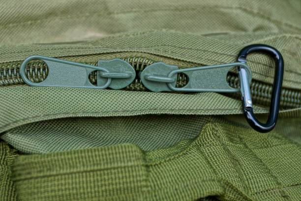 istock two big green metal zip on the backpack matter 1134388613