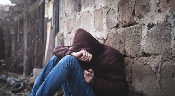 istock Caucasian homeless man sitting and thinking. 1134397437