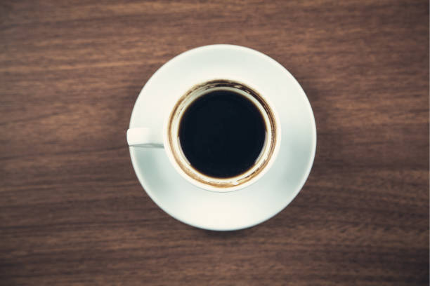 istock White coffee cup on a wooden desk. 1134397442