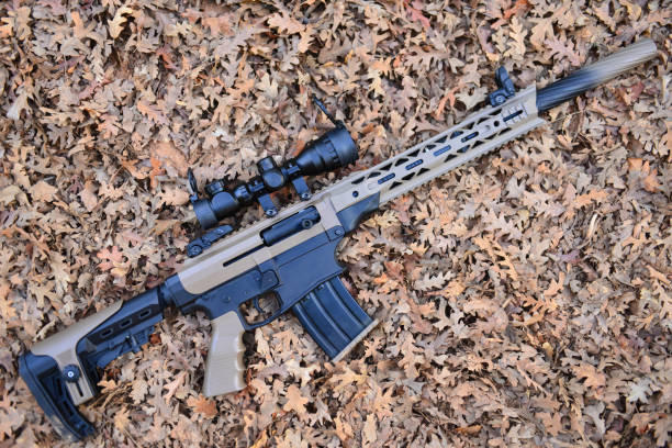 istock camouflage model with gun and concept 1134397576