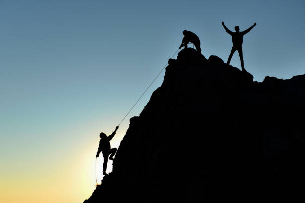 istock rock climbers and success memories 1134398387