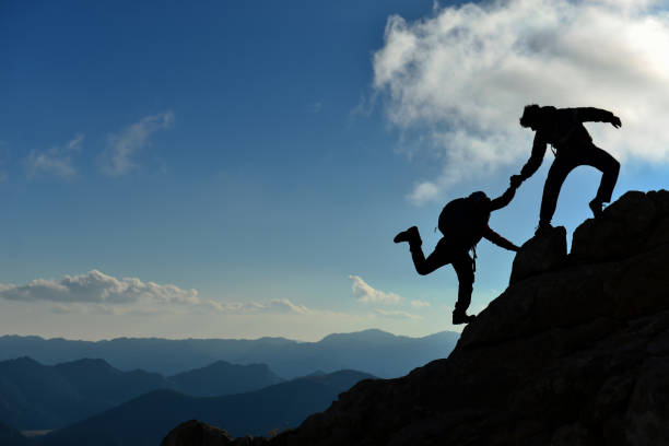 istock Peak triumph and success for climbers 1134398579