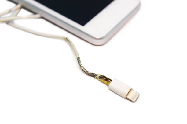 istock danger unsafe cable Phone Charger Lack of damage on white background 1134404841