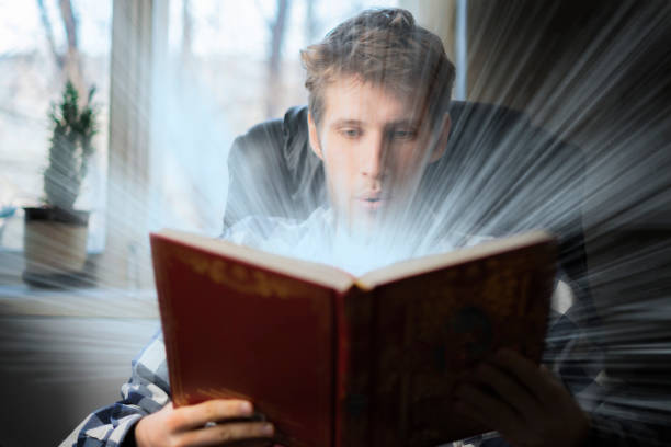 istock amazed teenager read shining book b 1134415522