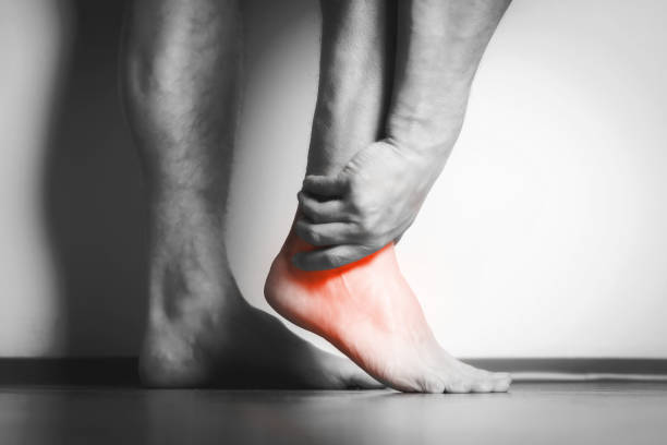 istock man with pain in foot 1134419938