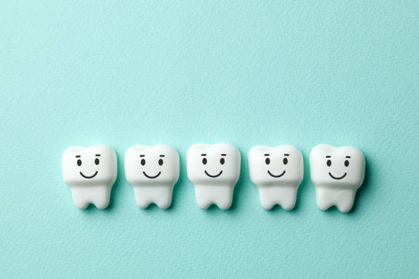 istock Healthy white teeth are smiling on green mint background 1134420542