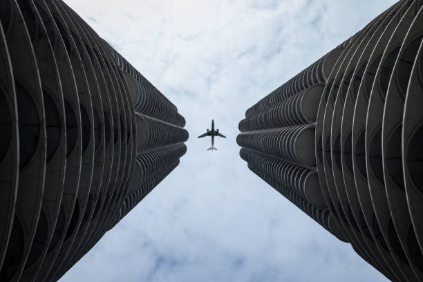 istock Landing Airliner above high buildings 1134423353