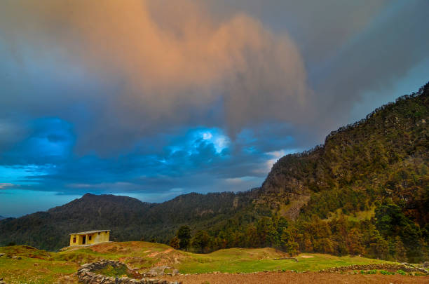 Sunset hues with mountain backdrop at Chopta, Garhwal, Uttarakhand, India