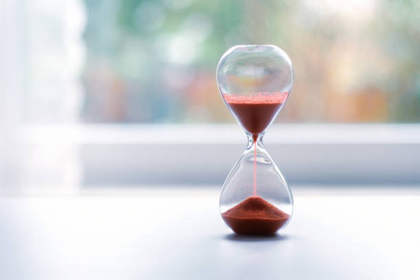 istock Hourglass at the window 1134424679