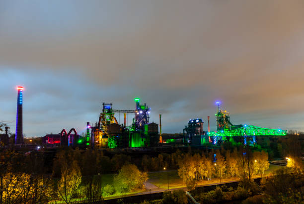 istock Old factory buildings illuminated at night 1134426345