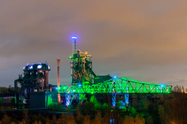 istock Old factory crane illuminated at night 1134426368