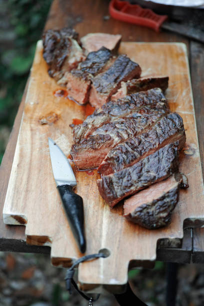 Grilled meat grilled meat on a cutting board grillade stock pictures, royalty-free photos & images