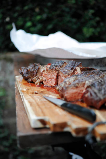 Grilled meat grilled meat on a cutting board grillade stock pictures, royalty-free photos & images