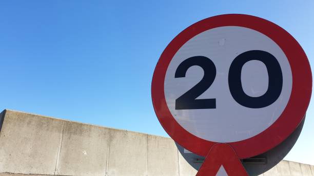 istock 20 speed limit sign with copy space against blue sky 1134430426