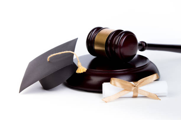 Graduation Hat with Diploma,Judge gavel on white background. stock photo