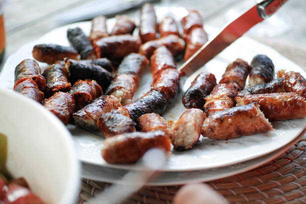 Grilled sausage Grilled sausage on a plate grillade stock pictures, royalty-free photos & images