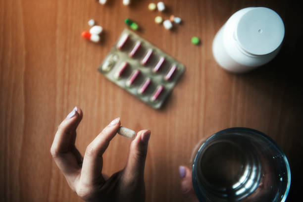 istock Asian woman is sick and taking medicine 1134432865