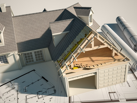 3D rendering of a house undergoing  renovation  on top of blueprints